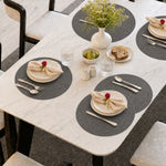 Charcoal | Charcoal Concentric Woven Round Polyester Placemats styled on a dining table