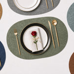 Sage | Oval Embossed Botanical PVC Placemats multi-color dining table arrangement with Sage featured