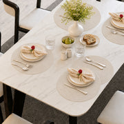 Cream | Cream Concentric Woven Round Polyester Placemats styled on a dining table