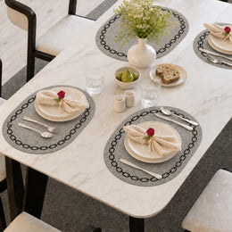 Ivory Black Chain | Ivory Black Chain Oval Chain Border PVC Placemats styled on a dining table