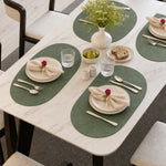 Sage | Sage Oval Embossed Botanical PVC Placemats styled on a dining table