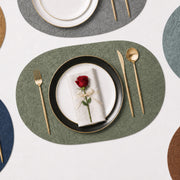 Sage | Oval Embossed Botanical PVC Placemats multi-color dining table arrangement with Sage featured