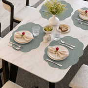 Sage | Sage Scalloped Round Woven Polyester Placemats styled on a dining table
