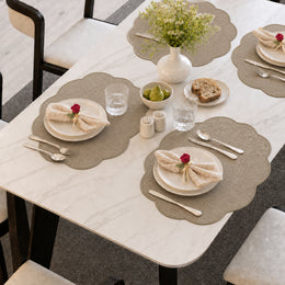 Taupe | Taupe Scalloped Round Woven Polyester Placemats styled on a dining table