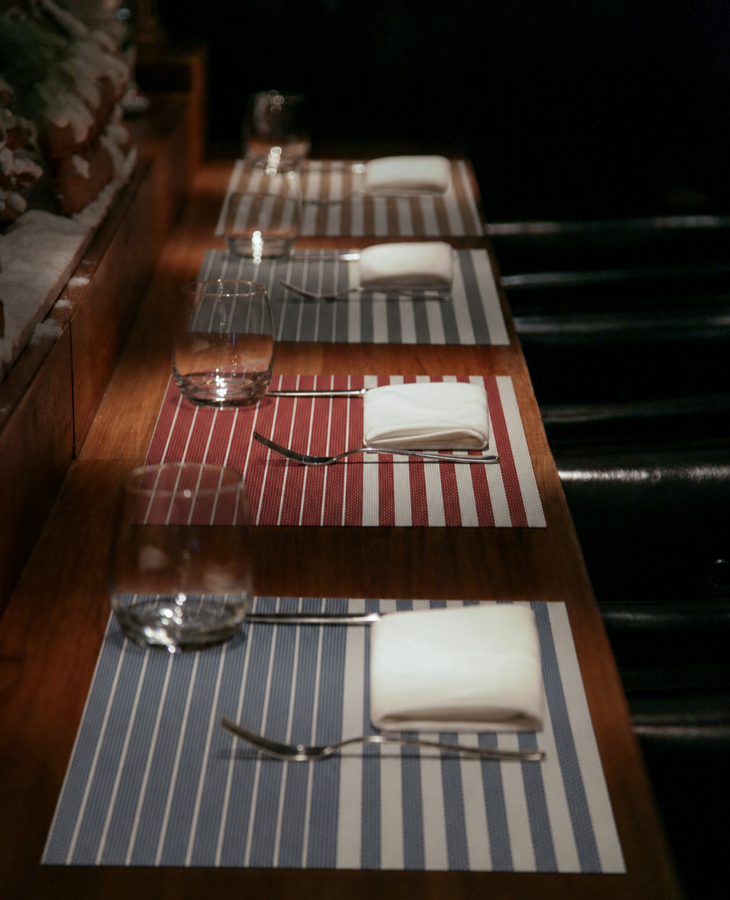 Rumiloo striped placemats in an elegant restaurant table setting